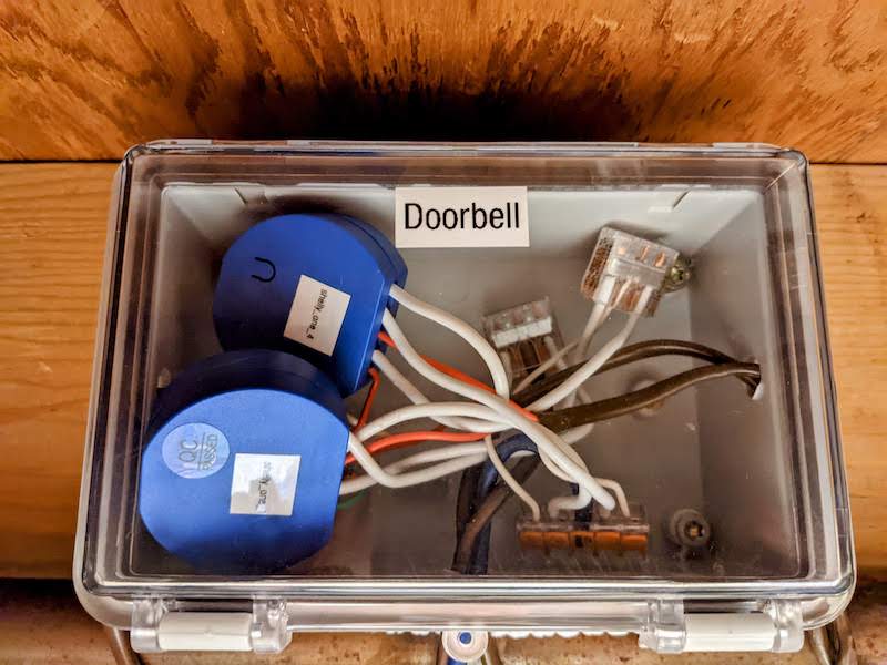 Two Shelly 1 inside of a conduit box wired up to each doorbell