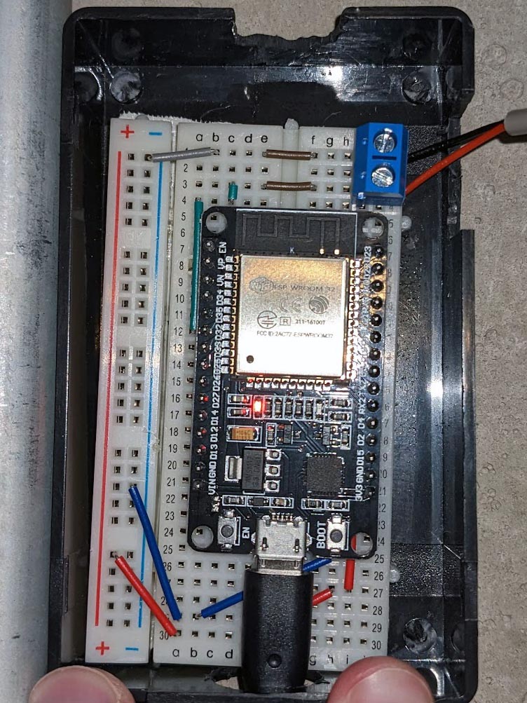 ESP32 dev board connected to a water meter